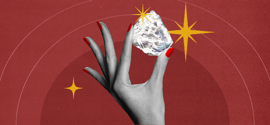Woman's hand holding a sparkling diamond which symbolizes the value of branding